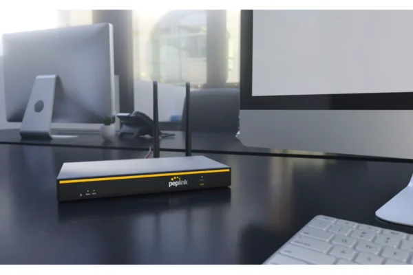 Peplink B One WiFi 6 router installed in small business office